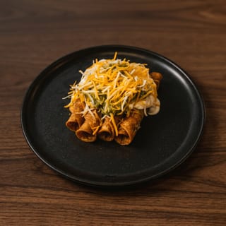 Rolled Taquitos with Cheese, Sour Cream & Guacamole