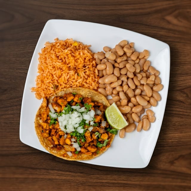 Steak or Chicken Taco with Rice & Beans.